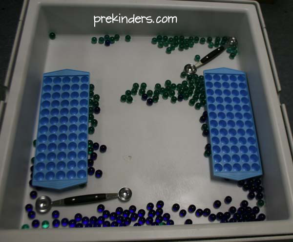 Marbles and Melon Scoops in the sensory table