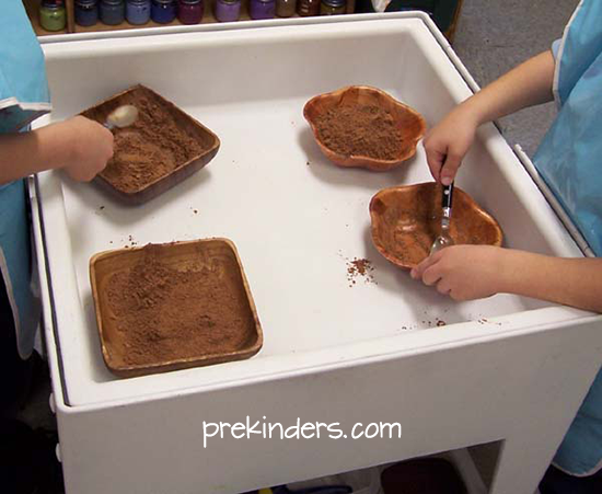 Transferring Cocoa in the Sensory Table