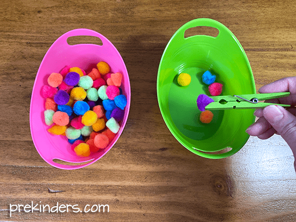 Pom Poms with clothespins and bowls