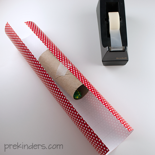 tape the wrapping paper to the tube