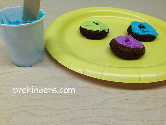 Donuts with icing spread on but the children