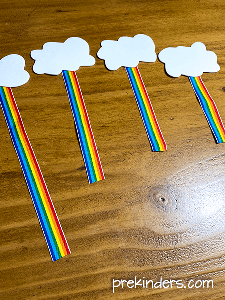 Attach rainbow ribbon to white foam clouds